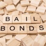 The,Word,Bail,Bonds,Spelled,Out,On,Wooden,Tile,With