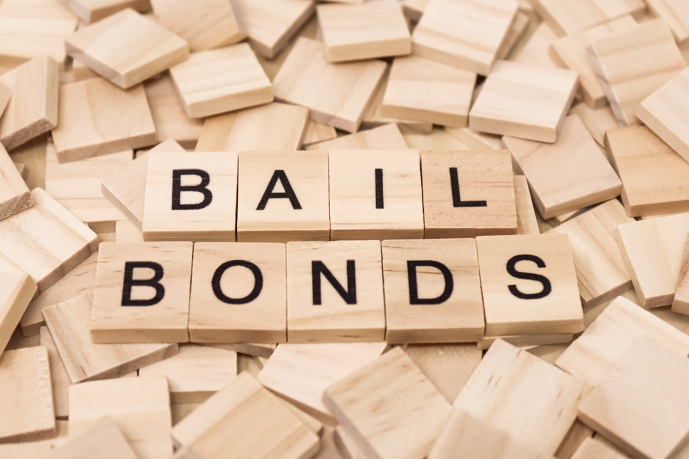 The,Word,Bail,Bonds,Spelled,Out,On,Wooden,Tile,With